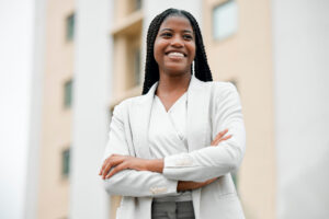 Arms crossed, happy vision and black woman with power, business
