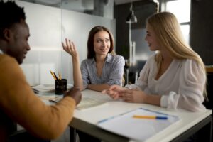 close-up-women-discussing-with-travel-agent