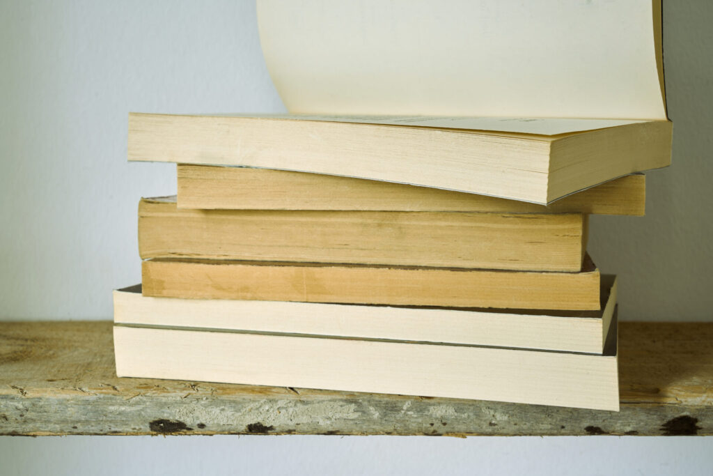 vecteezy_old-books-on-a-shelf_48961245